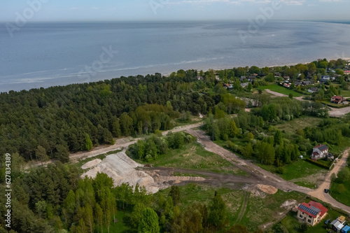 Top drone view of construction site in forest. White sand. Nature of Jurmala. Baltic sea. photo