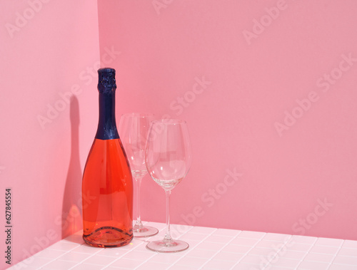 Concept of valentines day celebration. Bottle of wine and glasses. Copy space for text.