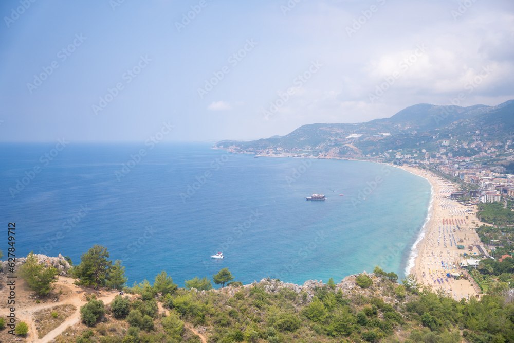 Aerial view of Cleopatra beach from mountain on blue sea background in Alanya, Turkey