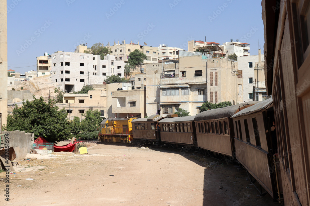 Amman, Jordan (a train among houses)  An old Turkish Ottoman steam train in Jordan - Hedjaz Jordan Railway