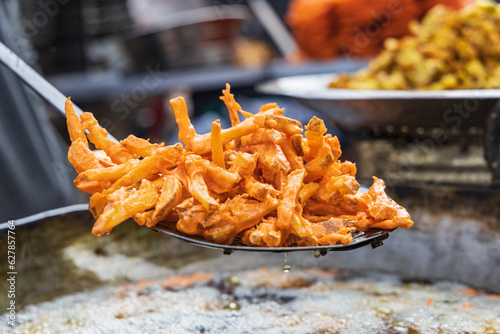 Fotografie Frying snack food for sale at a market in a village of Jammu and Kashmir