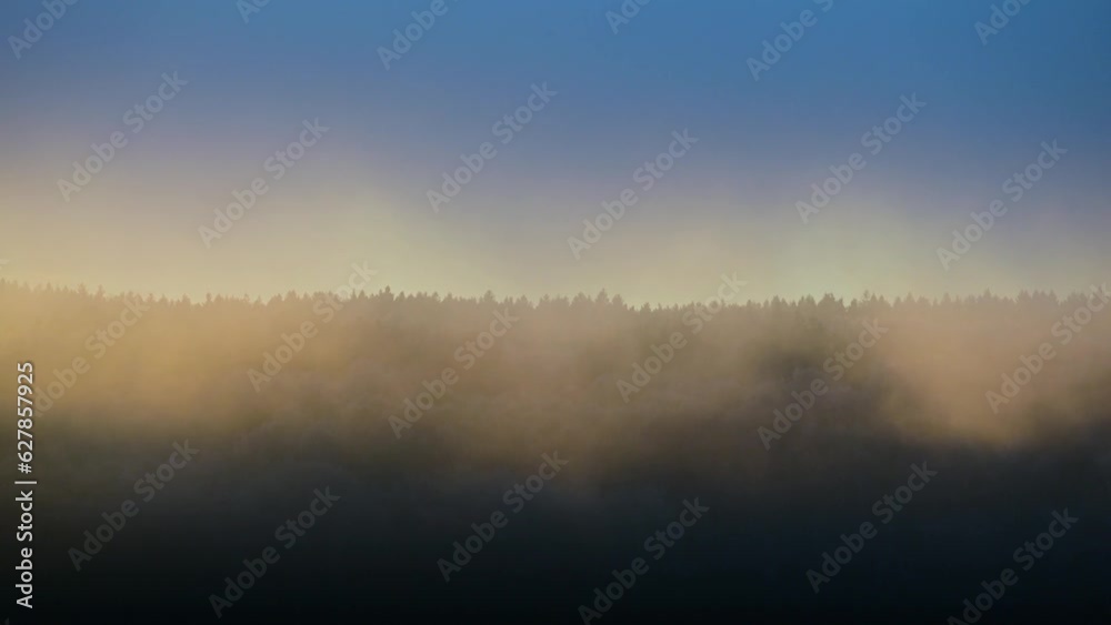 Early morning fog and sunrise over forest hills Early morning fog and sunrise over forest hills