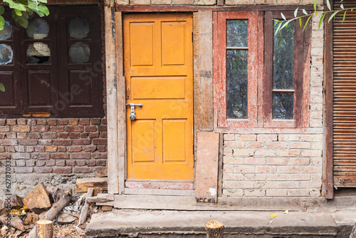 Yellow door in a brick house in Srinagar.