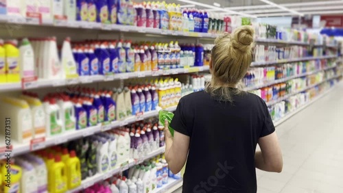 Wallpaper Mural supermarket shopping,Woman choosing a dairy products at supermarket. Torontodigital.ca