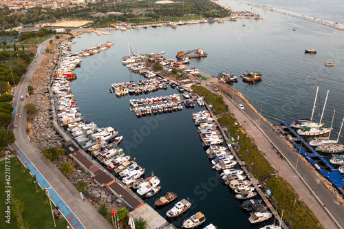 Drone view Maltepe Sahil at sunset. Aerial view of over park and harbor in Maltepe district on the Marmara Sea coast of the Asian side of Istanbul, Turkey. photo