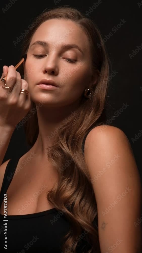 Young woman with natural make-up. The process of applying professional makeup on a model. Beauty face Young woman with natural make-up. The process of applying professional makeup on a model. Beauty face