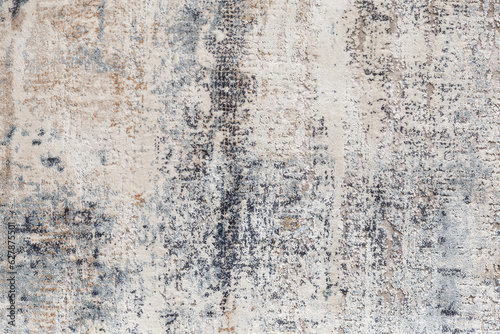 The texture of the carpet with an abstract pattern, close-up.
