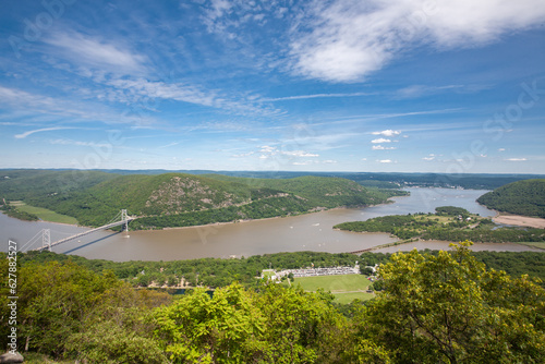 Bear Mountain State Park. Looking down at the Bear Mountain Bridge  from Perkins Memorial Drive on Bear Mountain. Parking area for Bear Mountain Inn and park are visible. photo