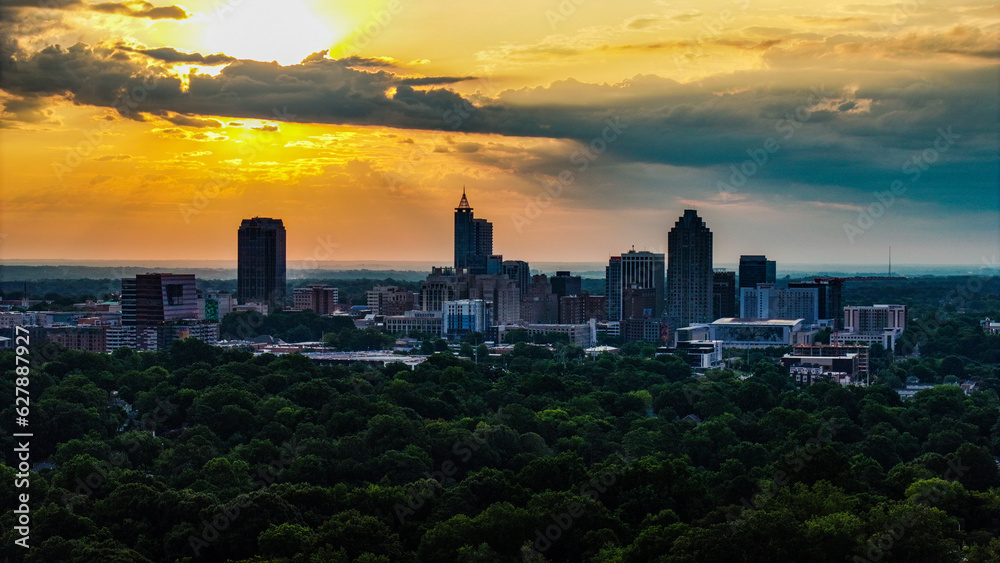 Fototapeta premium Raleigh Skyline at Sunrise with Dramatic Clouds - Aerial View