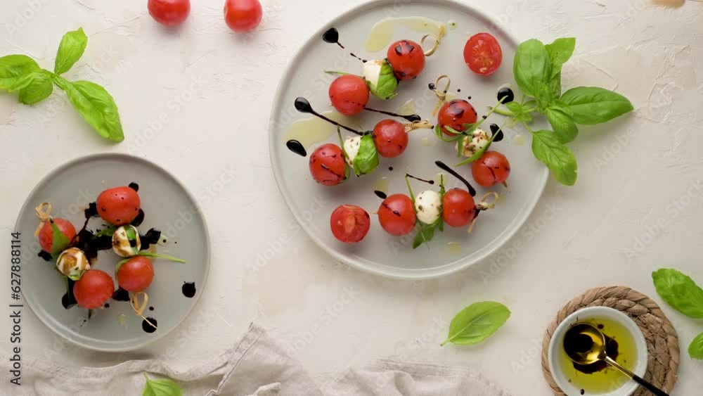 Healthy appetizer - caprese salad with tomato and mozzarella, italian food of mediterranean diet with olive oil dressing, weight loss concept Healthy appetizer - caprese salad with tomato and mozzarella, italian food of mediterranean diet with olive oil dressing, weight loss concept