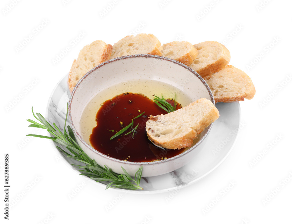 Bowl of balsamic vinegar with oil, rosemary and bread slices on white background Bowl of balsamic vinegar with oil, rosemary and bread slices on white background