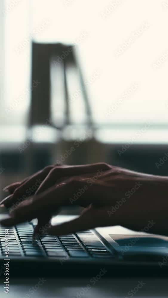 Vertical video. Remote business. Internet communication. Modern technology. Freelancer woman hands scrolling touchpad typing on laptop keyboard at home office workplace. Vertical video. Remote business. Internet communication. Modern technology. Freelancer woman hands scrolling touchpad typing on laptop keyboard at home office workplace.