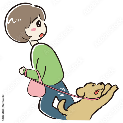 犬の散歩をしながら何かに注目する女性