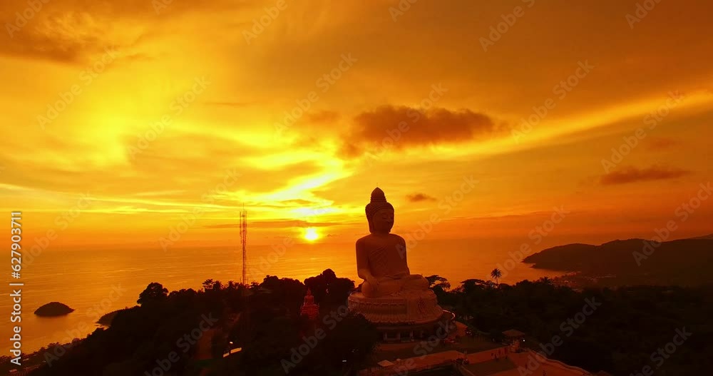 aerial view colorful yellow cloud in golden sky in sunset at Phuket big Buddha..creative travel concept. stunning yellow sky background..Phuket big Buddha is the popular landmark in Phuket.