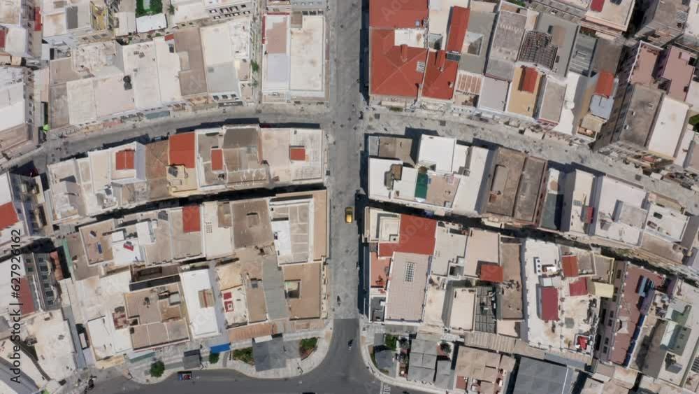Top down drone shot of Miaouli square and city hall building in Ermoupoli city of Syros island, Greece during morning hours Top down drone shot of Miaouli square and city hall building in Ermoupoli city of Syros island, Greece during morning hours