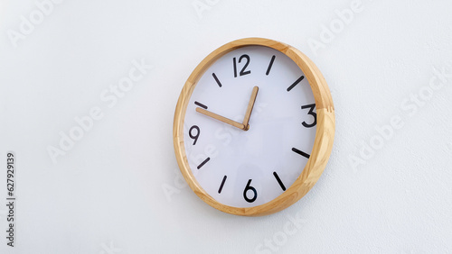 Modern wooden round clock on white wall background, Flat timer watch simple design decorate in office