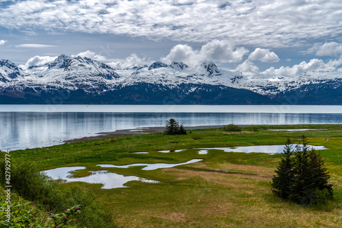 The floodplain at the mouth of Gold Creek and the Chugach Mountains across the bay, Port Valdez, Alaska photo