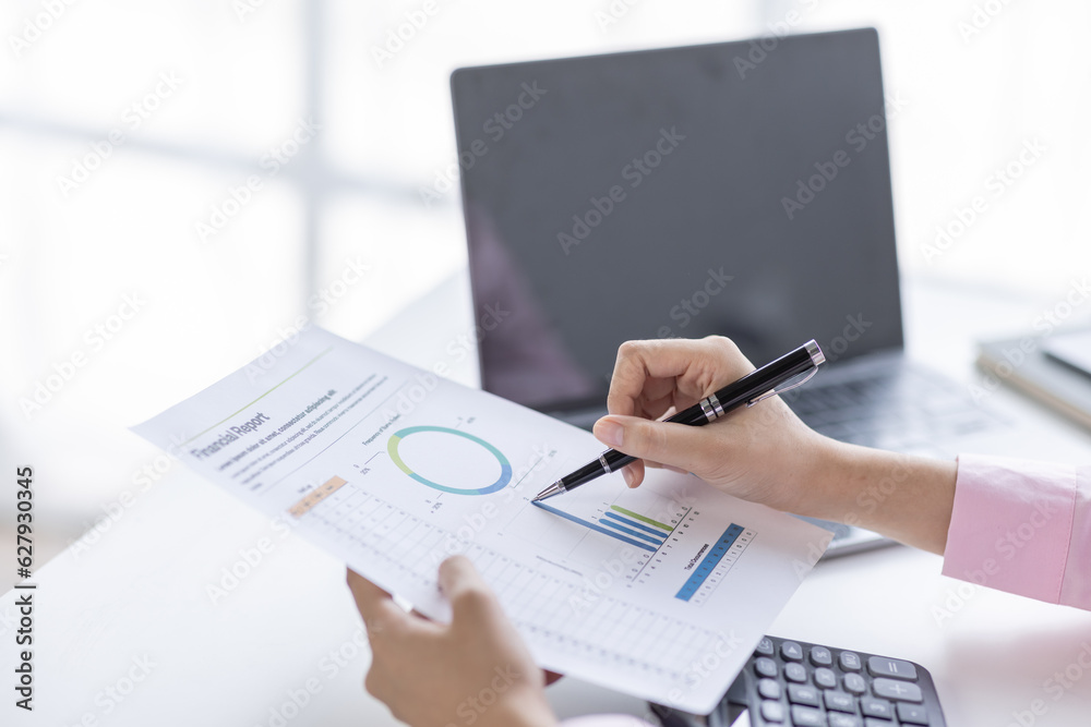 Asian Businesswoman Using laptop computer and working at office with calculator document on desk, doing planning analyzing the financial report, business plan investment, finance analysis concept.
Asian Businesswoman Using laptop computer and working at office with calculator document on desk, doing planning analyzing the financial report, business plan investment, finance analysis concept.