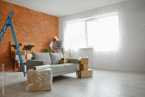 Sofa with cardboard boxes i...