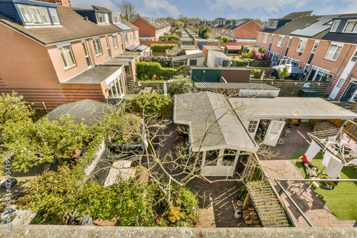 an aerial view from the roof of a house with trees and bushes in the fore - image taken from above