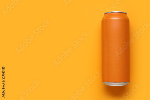 Can of soda on orange backg...