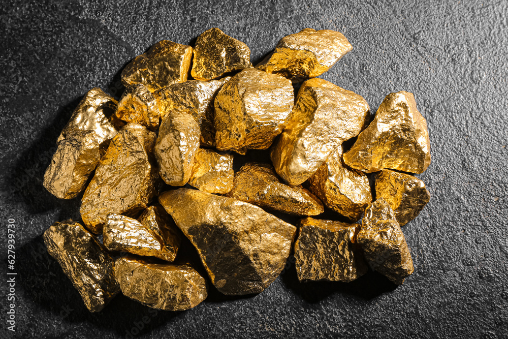 Golden nuggets on dark background Golden nuggets on dark background