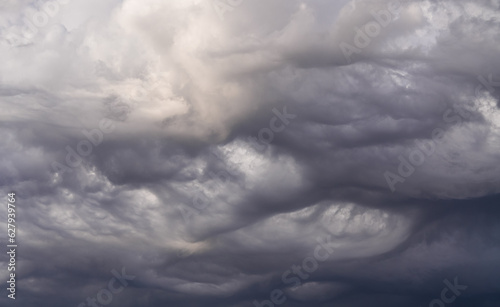 Storm clouds. Dramatic sky with lenticular cumulonimbus cumulus clouds during a summer storm. Clouds atlas.