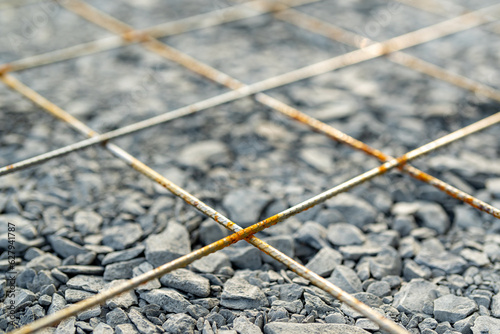 Welded wire mesh, WWM, installed within a sidewalk concrete form prior to the installation of concrete.  photo