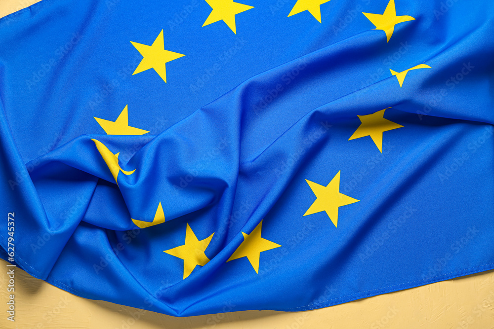 European Union flag on yellow background European Union flag on yellow background