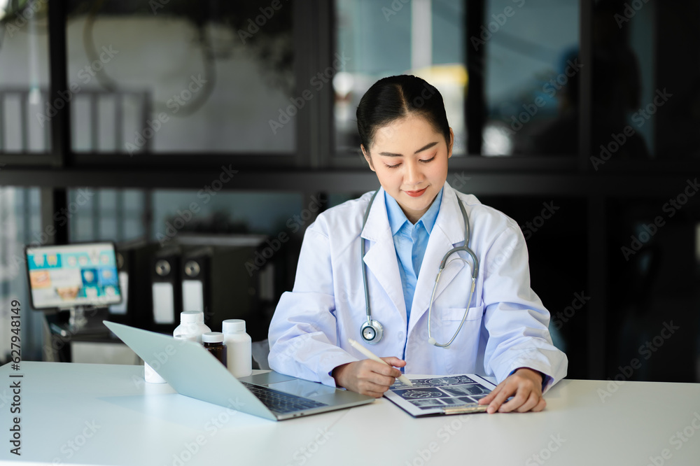 Asian doctor working with mobile phone and stethoscope in office. Medical technology concept. Asian doctor working with mobile phone and stethoscope in office. Medical technology concept.
