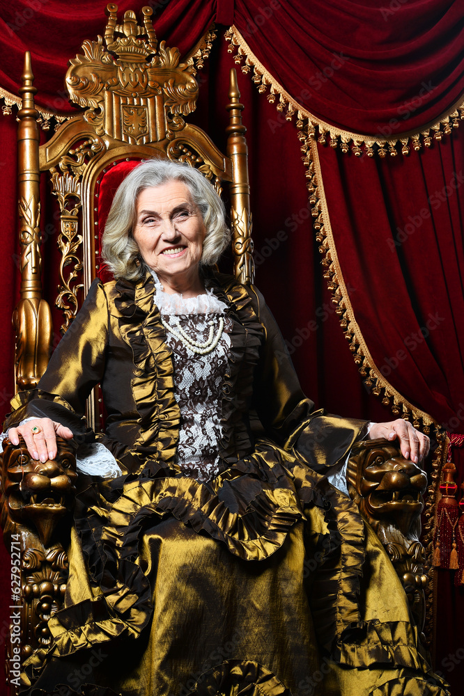 Close-up portrait of surprised beautiful senior queen on throne