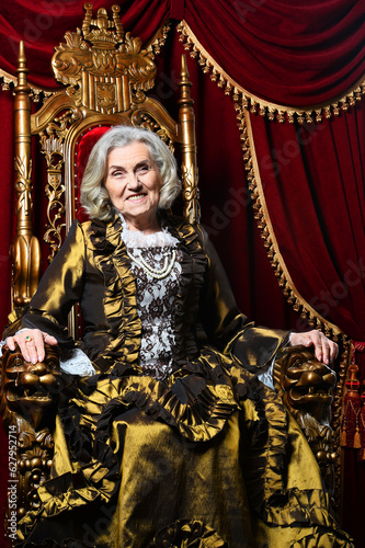 Close-up portrait of surprised beautiful senior queen on throne