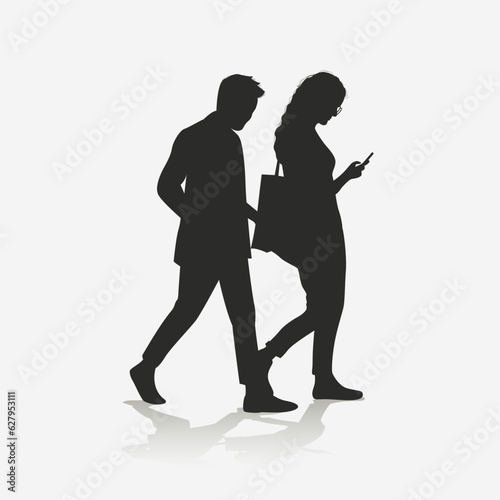 Silhouette of a couple walking, holding cellphones