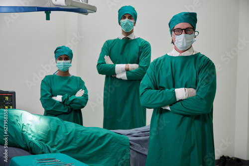 Professional doctors team, specialist surgeons in uniforms, White professors, and assistants wear operating face masks, surgery on critically ill patients in hospital's ICU, and paramedic occupation.