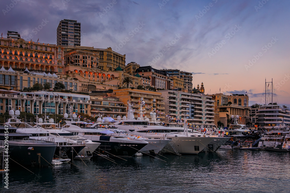 Luxury apartment buildings and yachts in the Yacht Club marina harbor for the Monaco Grand Prix F1 race, Monte Carlo, Monaco