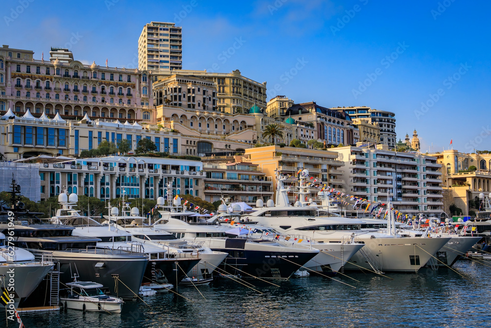 Luxury apartment buildings and yachts in the Yacht Club marina harbor for the Monaco Grand Prix F1 race, Monte Carlo, Monaco