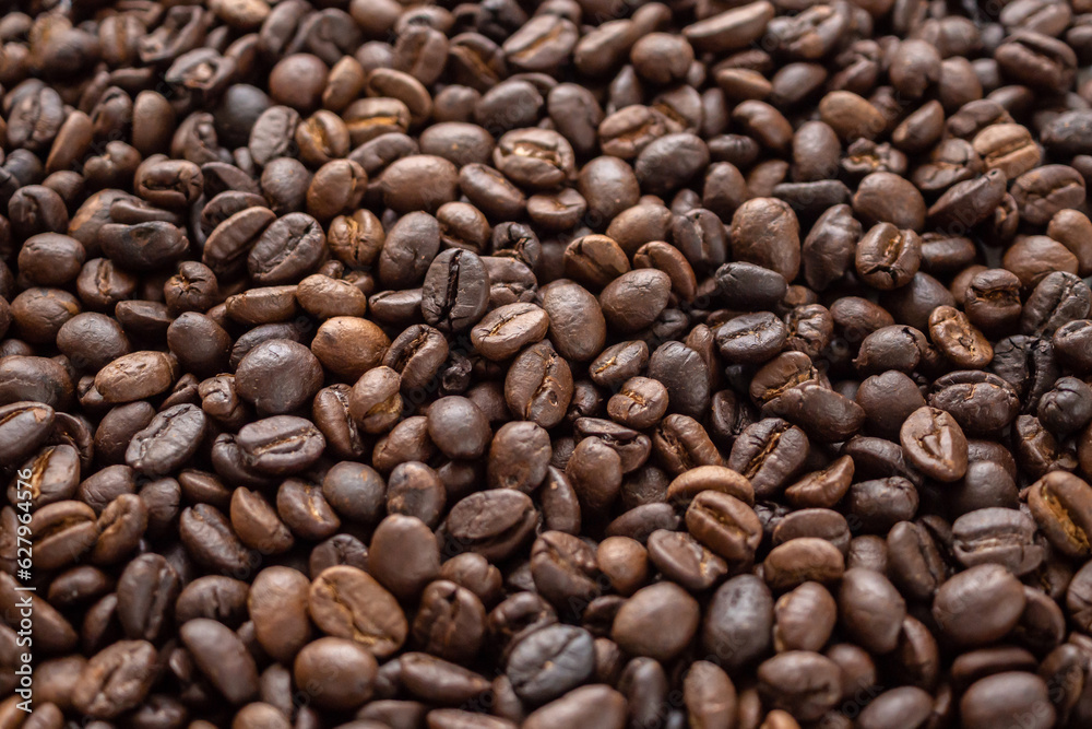 Fototapeta premium Fresh roasted brown coffee beans background