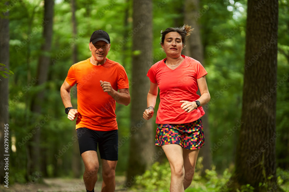 Running couple in the forest Running couple in the forest