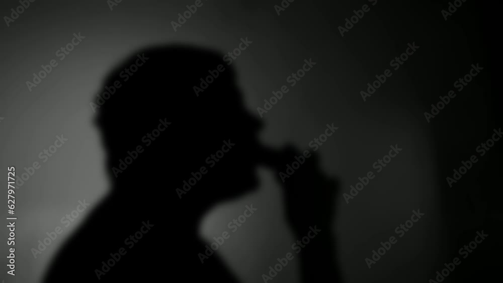 Blurred shadow of a smoking vape cigarette Blurred shadow of a smoking vape cigarette