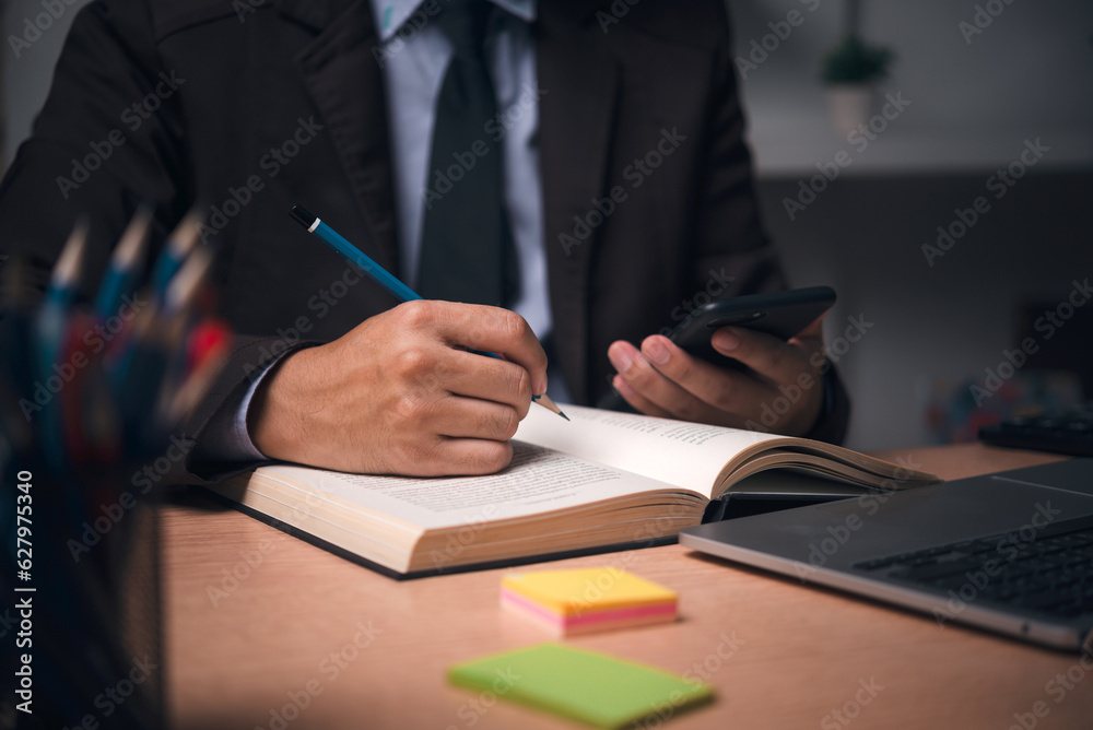 learning online class by using laptop computer and writing notebook at workplace, Education development or knowledge improvement concept. learning online class by using laptop computer and writing notebook at workplace, Education development or knowledge improvement concept.
