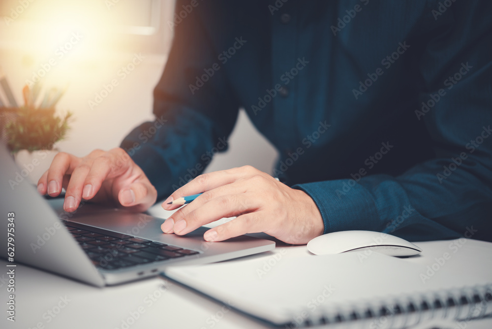 Businessman using laptop computer for working internet online research Information and data analysis. Technology and innovation and growth concept Businessman using laptop computer for working internet online research Information and data analysis. Technology and innovation and growth concept
