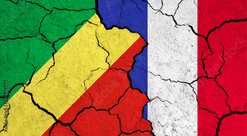 Flags of Congo and France on cracked surface - politics, relationship concept