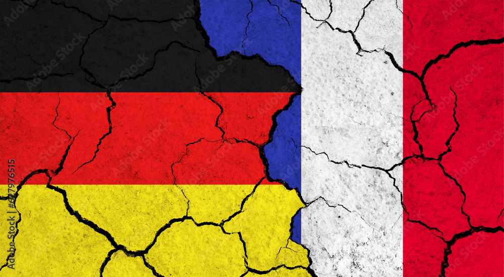 Flags of Germany and France on cracked surface - politics, relationship concept
