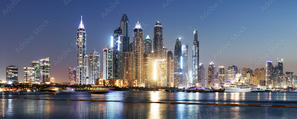 Panorama of Dubai Marina at night with scyscrapers skyline, UAE