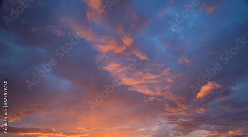Fototapeta Naklejka Na Ścianę i Meble -  Sunset sky. Abstract nature background. Dramatic blue with orange colorful clouds in twilight time.