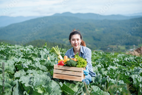 Farmer harvest or inspect farm products quality and fresh vegetables.