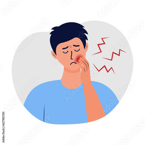Man holding his cheek and suffering from toothache. Concept of caries, severe pain in the teeth, oral treatment, dental problem.