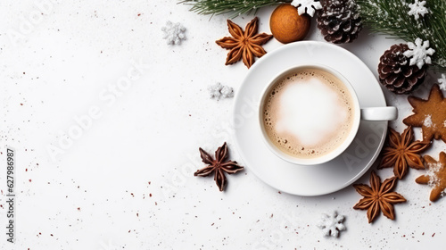 Delicious fresh festive morning cappuccino coffee in a ceramic blue cup on the warm cover with little wrapped gifts, red ornamentals, fireflies and spruce branches