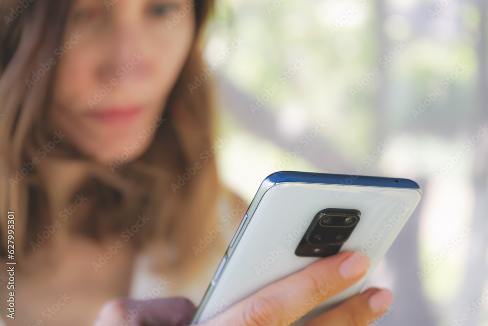 woman holding a mobile phone in her hands close-up woman holding a mobile phone in her hands close-up
