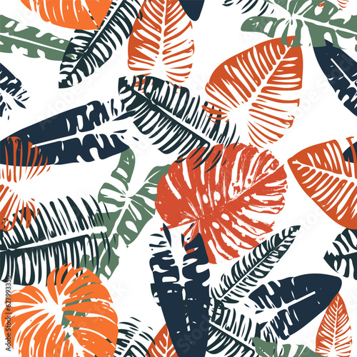 Seamless pattern of colorful tropical leaves on a white background.
